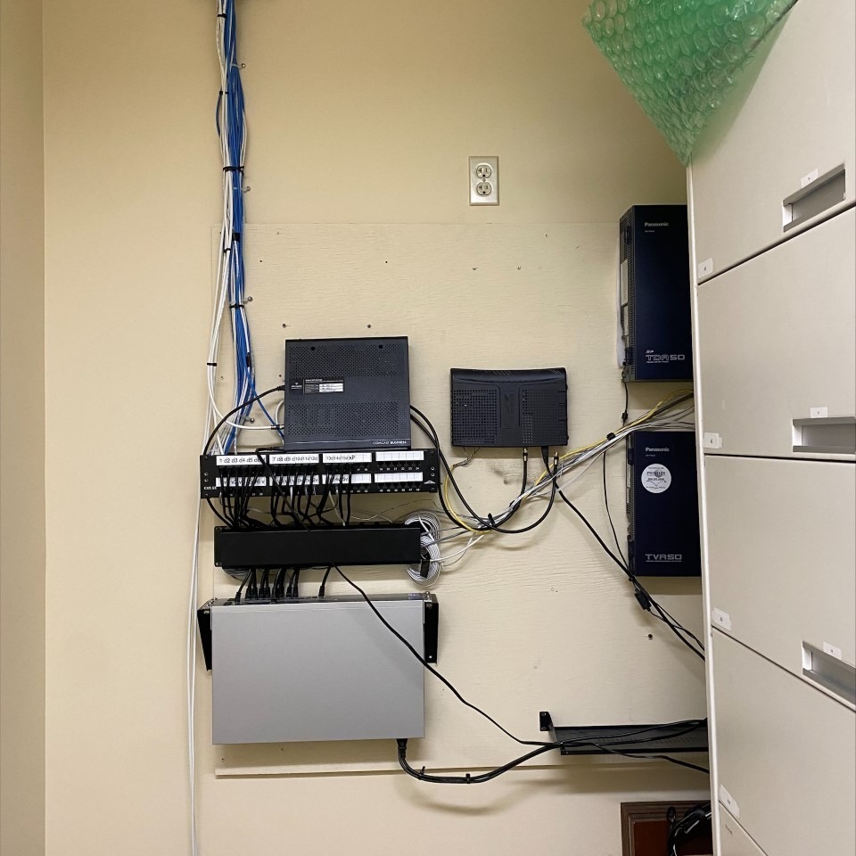 Different network equipment hanging on wall. Recent projects.